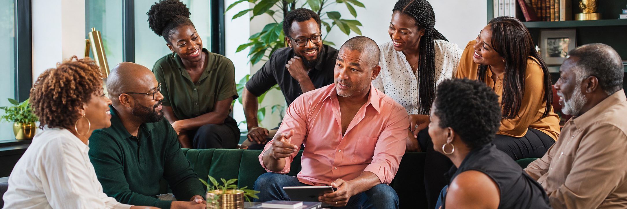 Black professionals collaborating around a table in a modern workspace